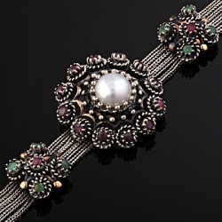 Armband. Perle, Smaragde, Rubine
