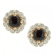 Goldene Ohrringe mit Saphiren und Diamanten