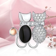 Silberbrosche mit Gold "Kaetzchen". Zirkonia & Onyx