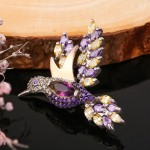 Silberbrosche mit Gold "Kolibri". Zirkonia & Juwelierglas
