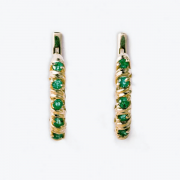 Goldene Ohrringe mit Smaragden