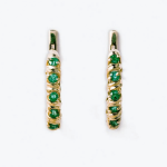 Goldene Ohrringe mit Smaragden